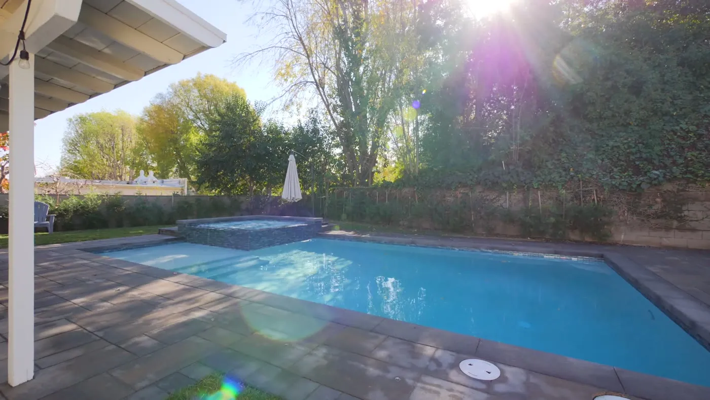 Pool and raised spa with spillway at the Johnston residence in Woodland Hills