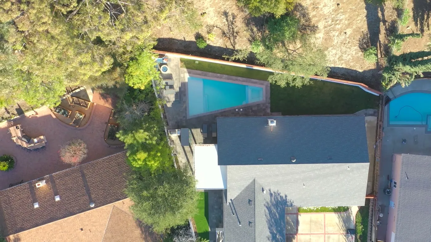 Aerial view of the yard between house and hillside