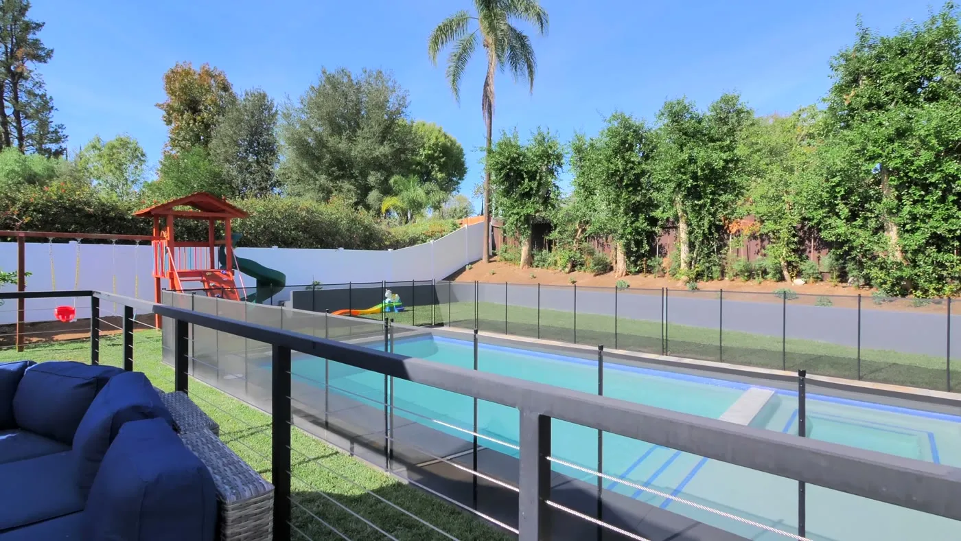 Removable mesh safety fence around the pool perimeter