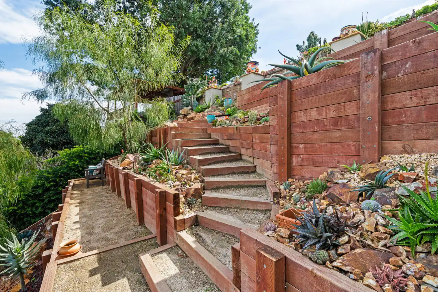 Engineered timber retaining walls terracing a Southern California hillside